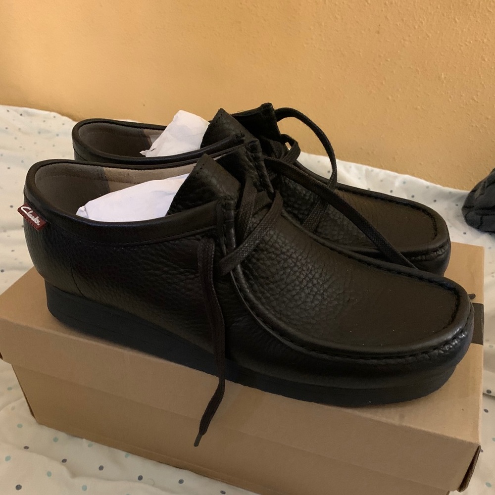 Black Clark’s leather boots.